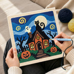 Creating handmade spooky haunted house punch needle artwork