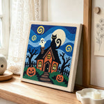 Spooky haunted house punch needle artwork displayed on a table