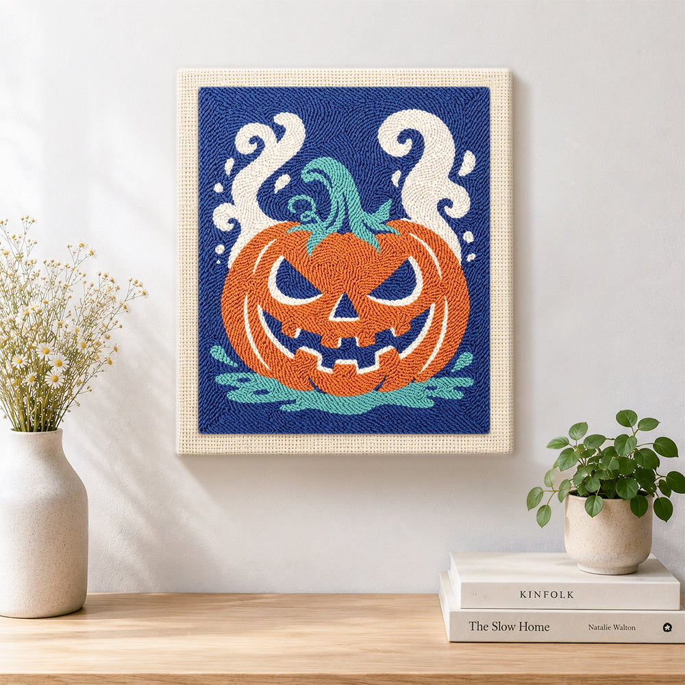 Finished spooky jack‑o‑lantern artwork displayed on a wall