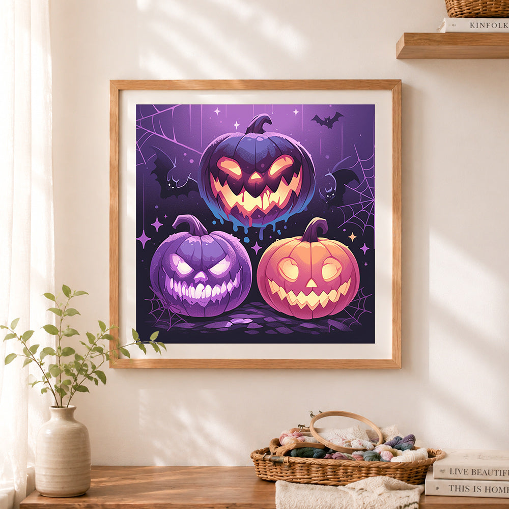 Finished spooky jack-o’-lanterns cross stitch artwork displayed as home decor