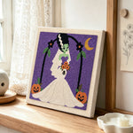 Spooky monster bride punch needle artwork displayed on a table
