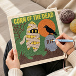 Creating handmade spooky mummy corn punch needle artwork