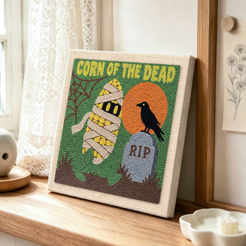 Spooky mummy corn punch needle artwork displayed on a table