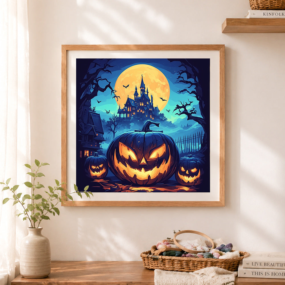 Finished spooky pumpkin halloween cross stitch artwork displayed as home decor