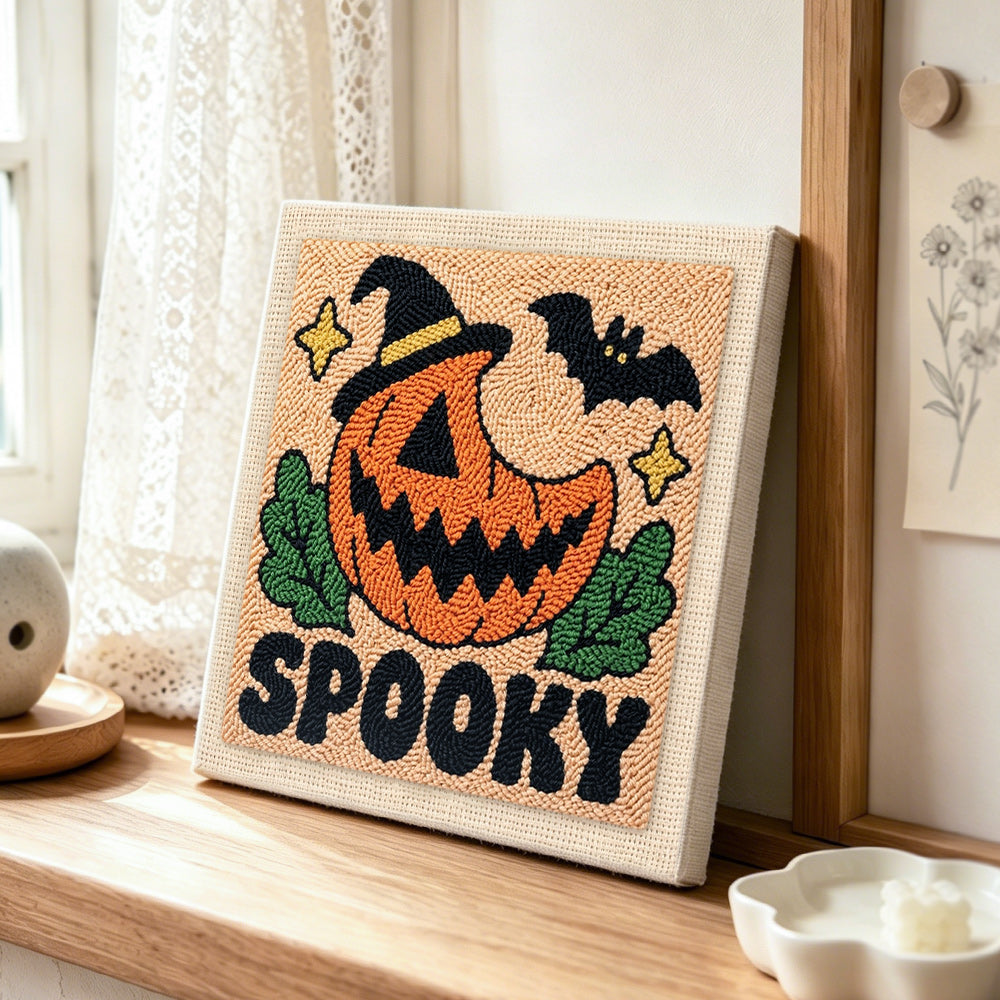 Spooky pumpkin jack punch needle artwork displayed on a table