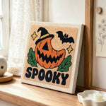 Spooky pumpkin jack punch needle artwork displayed on a table