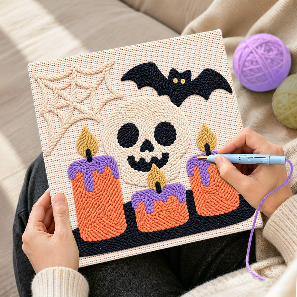Creating handmade spooky skull candles punch needle artwork