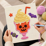 Creating handmade spooky skull ice cream cup punch needle artwork