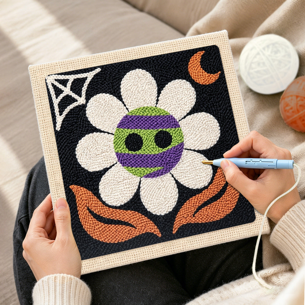 Creating handmade spooky striped flower punch needle artwork