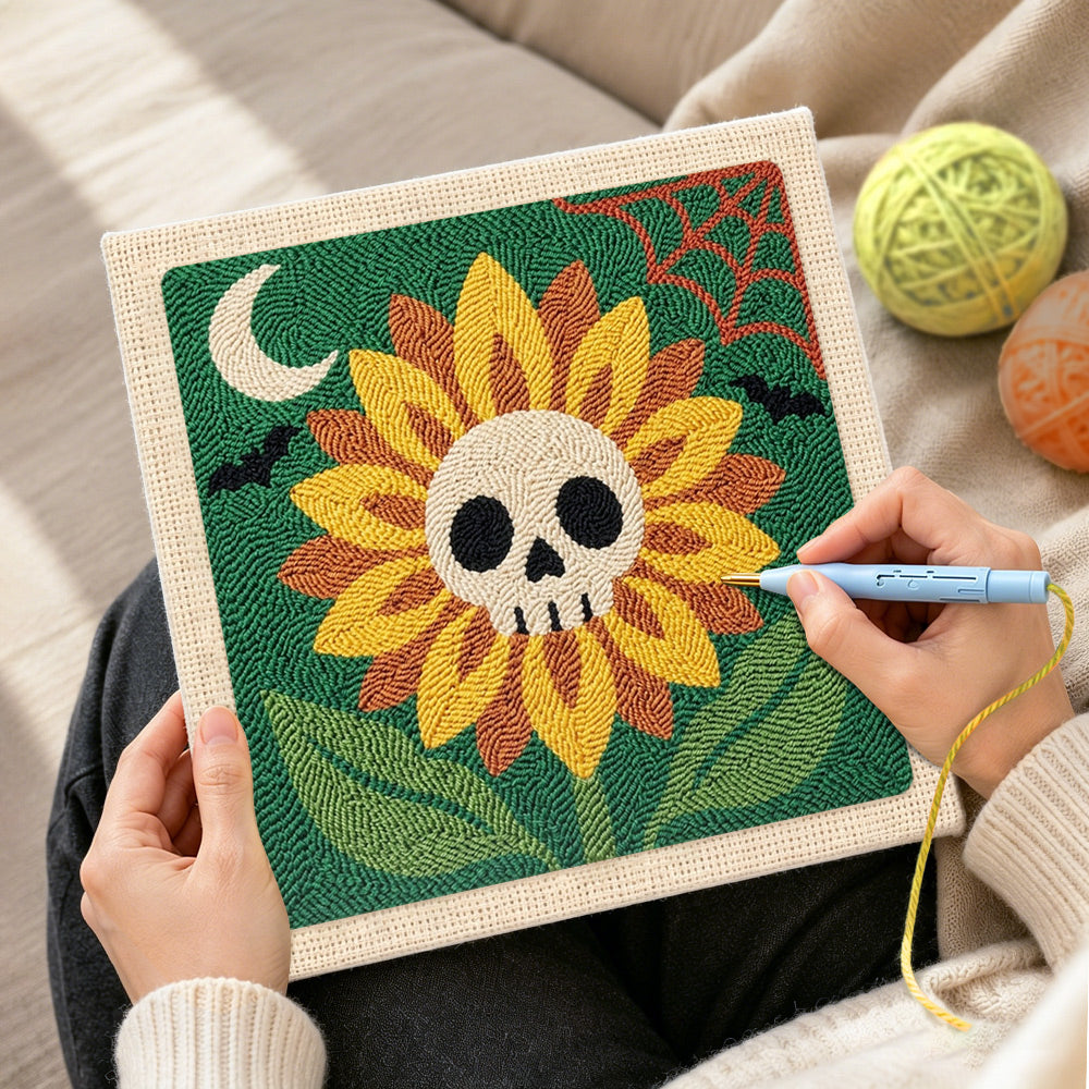 Creating handmade spooky sunflower with skull center punch needle artwork