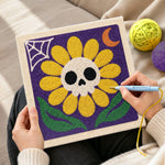 Creating handmade spooky sunflower with skull punch needle artwork
