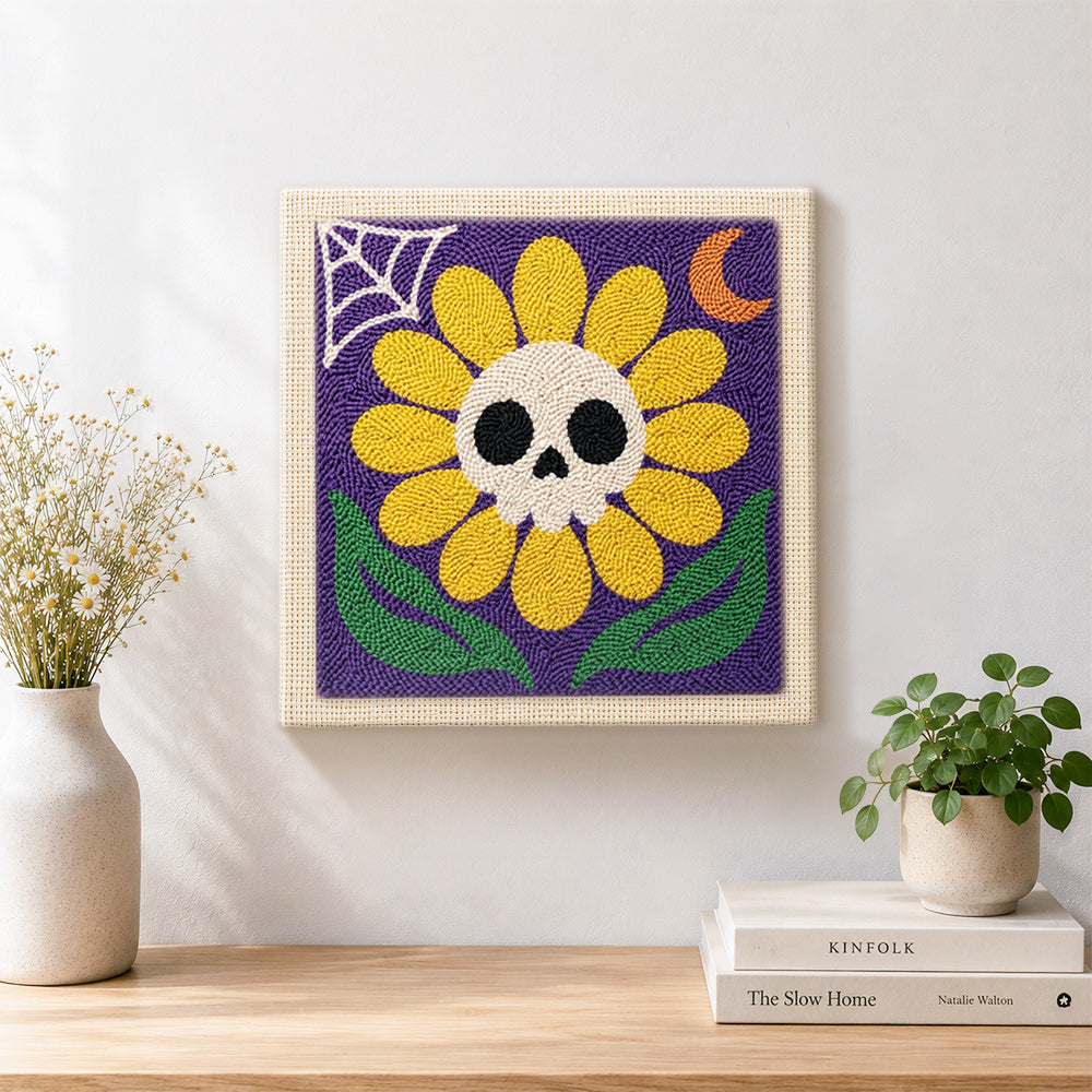 Finished spooky sunflower with skull artwork displayed on a wall