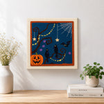 Finished spooky tree and ravens artwork displayed on a wall
