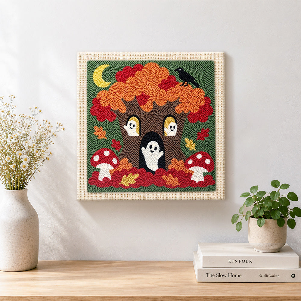 Finished spooky tree with little ghosts artwork displayed on a wall