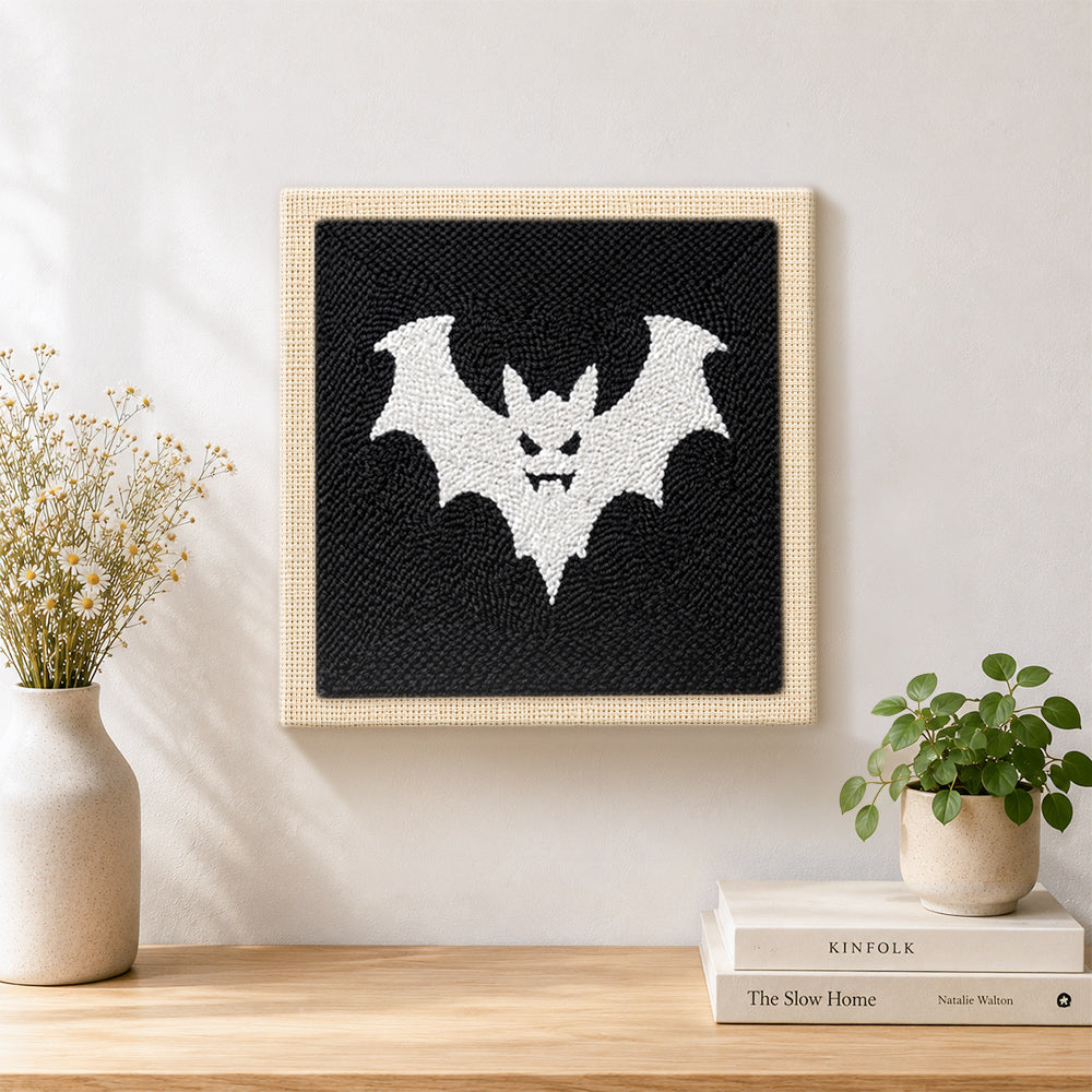 Finished spooky white bat artwork displayed on a wall