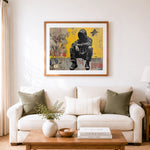 Finished squatted youth against yellow wall cross stitch artwork displayed as home decor