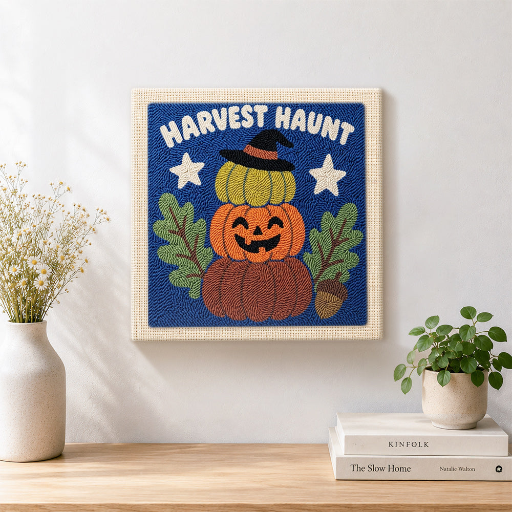 Finished stacked harvest pumpkins artwork displayed on a wall