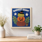 Finished stacked harvest pumpkins artwork displayed on a wall
