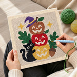 Creating handmade stacked pumpkins with black cat punch needle artwork