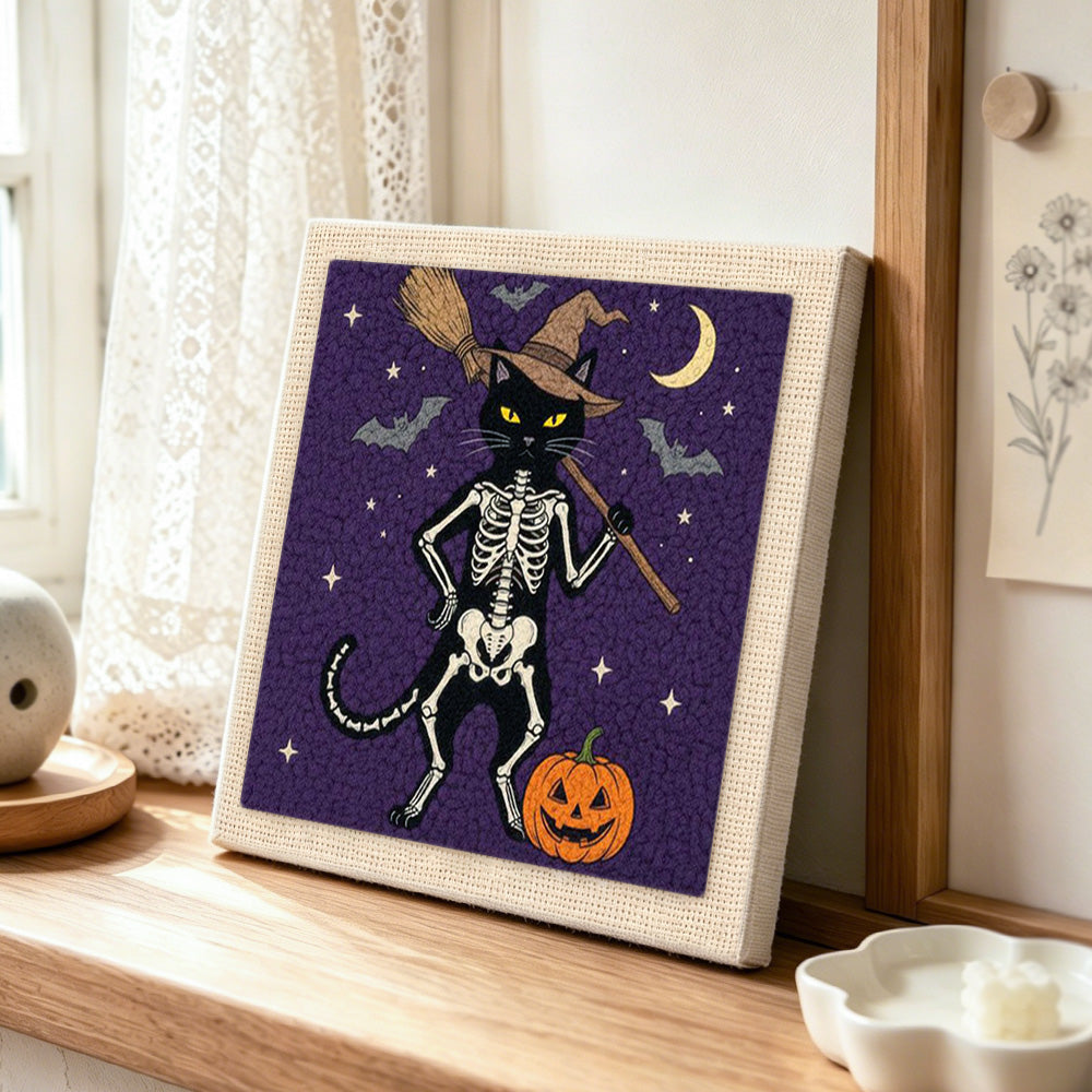 Standing skeleton cat punch needle artwork displayed on a table