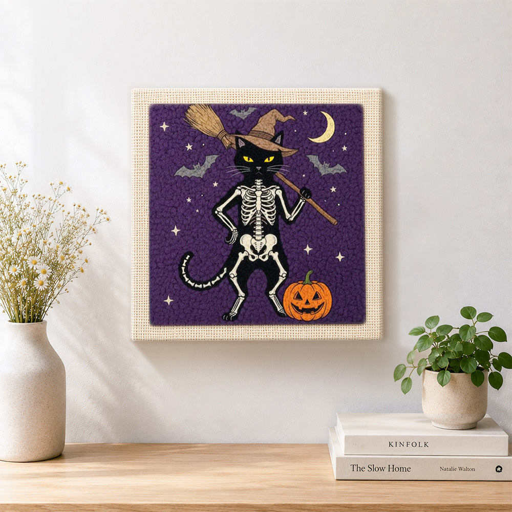Finished standing skeleton cat artwork displayed on a wall