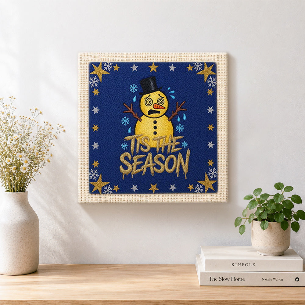 Finished star border sad snowman artwork displayed on a wall