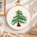 Starry christmas tree with stars embroidery hoop wall art displayed as warm and cozy handmade home decor
