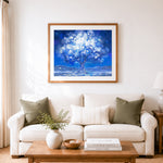 Finished starry glowing tree cross stitch artwork displayed as home decor
