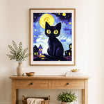 Finished starry night black cat cross stitch artwork displayed as home decor