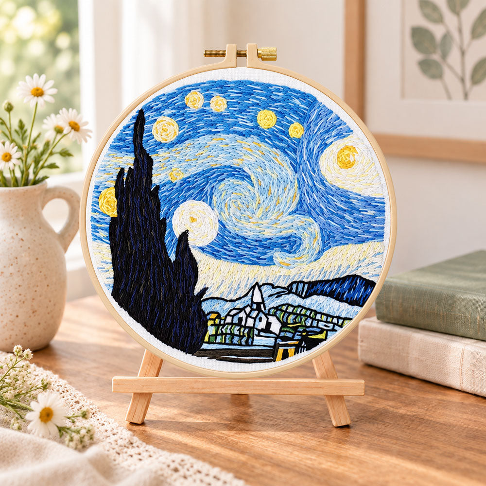 Starry night embroidery scene embroidery kit finished hoop displayed on a wooden stand as cozy tabletop decor