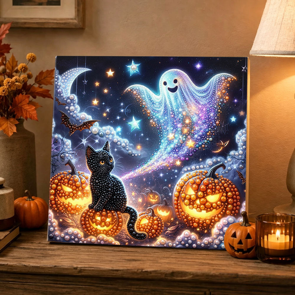 Finished starry night ghost and black cat pearl diamond painting artwork displayed as holiday home decor