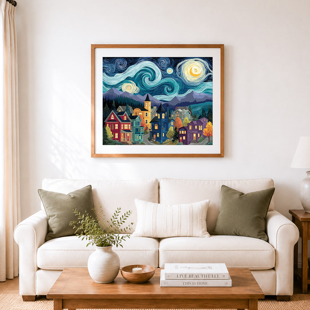 Finished starry night mountain town cross stitch artwork displayed as home decor
