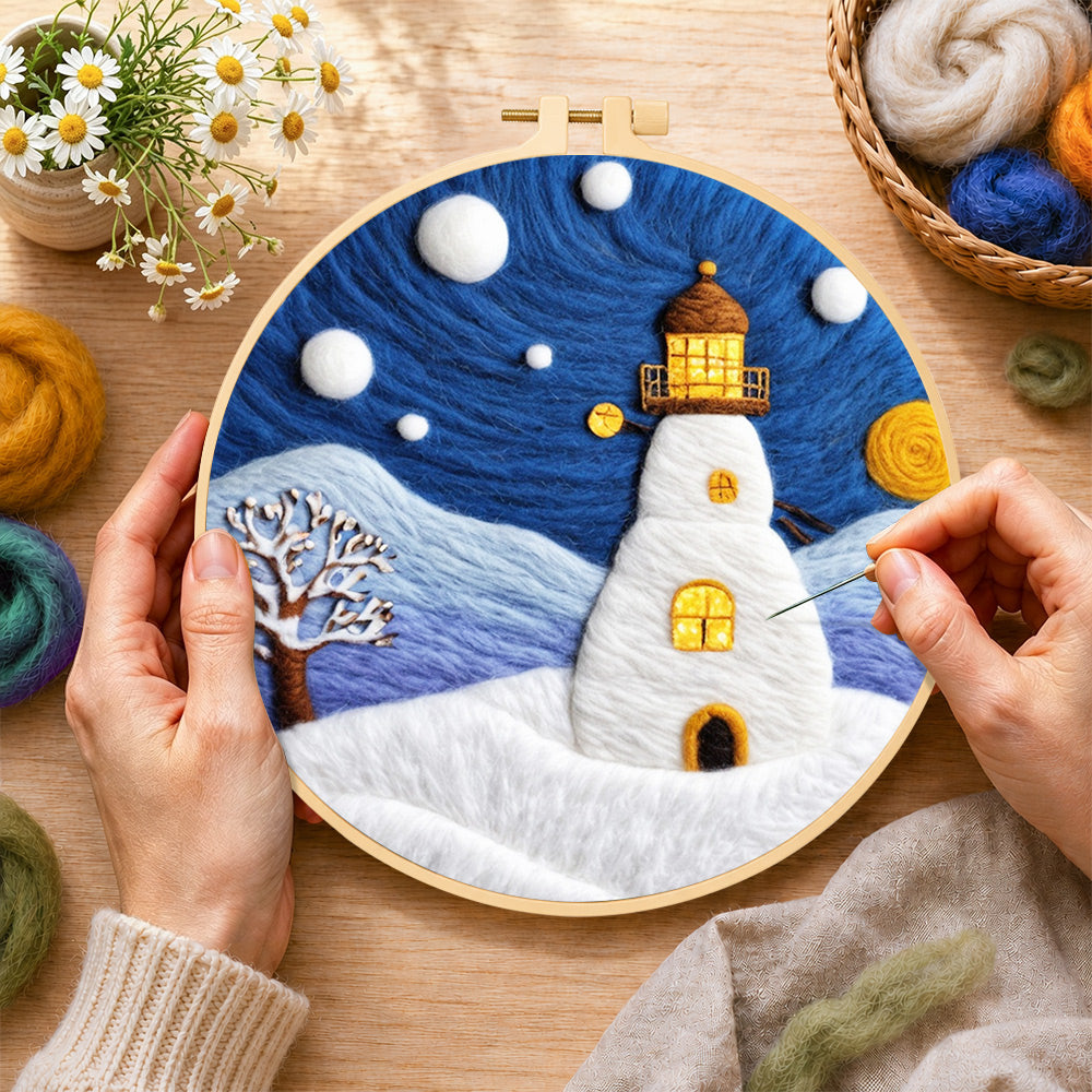 Creating the starry night snowy lighthouse wool painting by hand with a felting needle