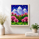 Finished starry sakura mountain at night artwork displayed on a wall