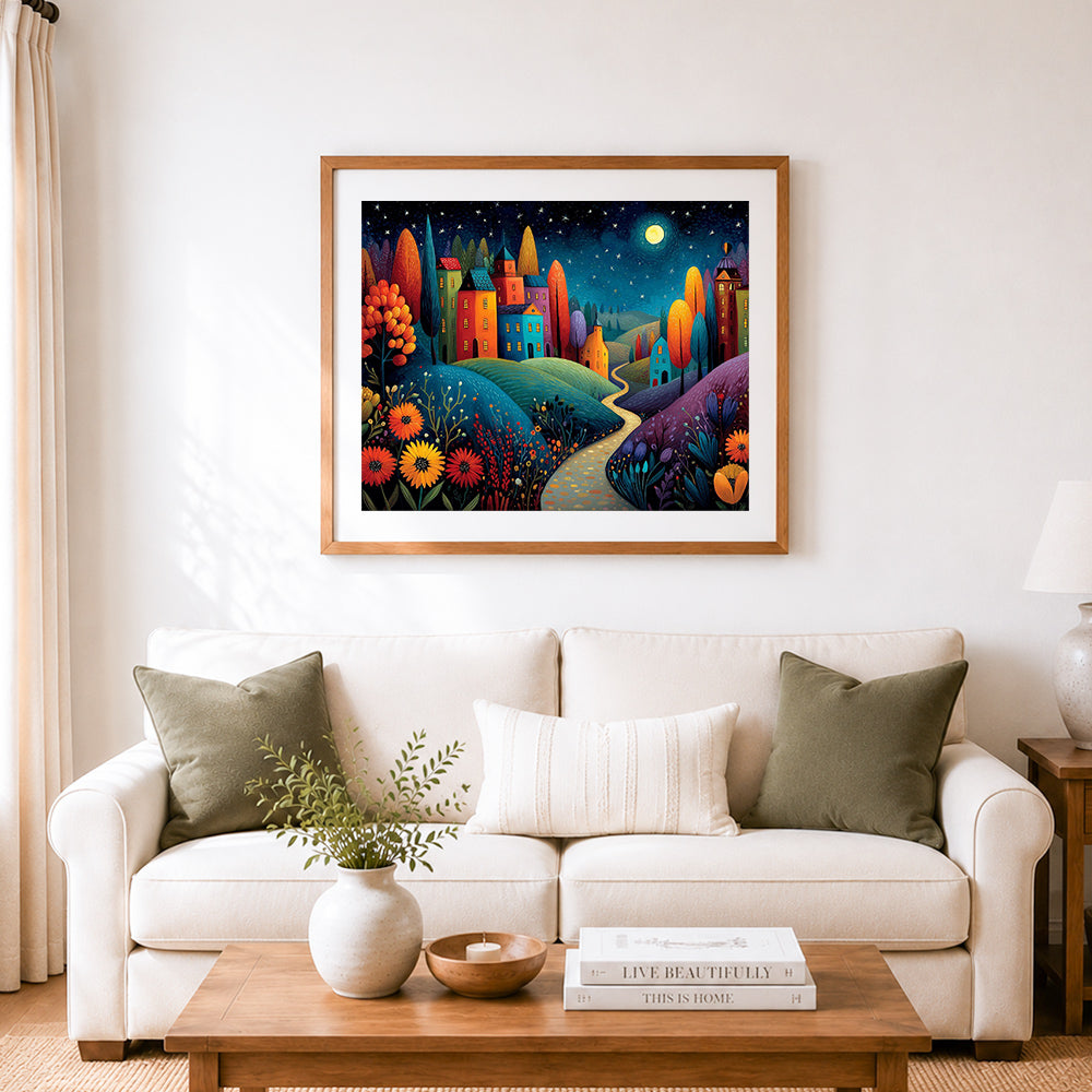Finished starry whimsical village cross stitch artwork displayed as home decor