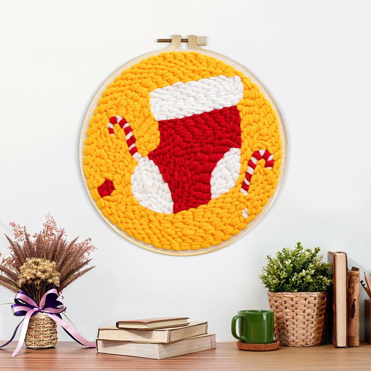 Finished stocking and candy canes artwork displayed on a wall