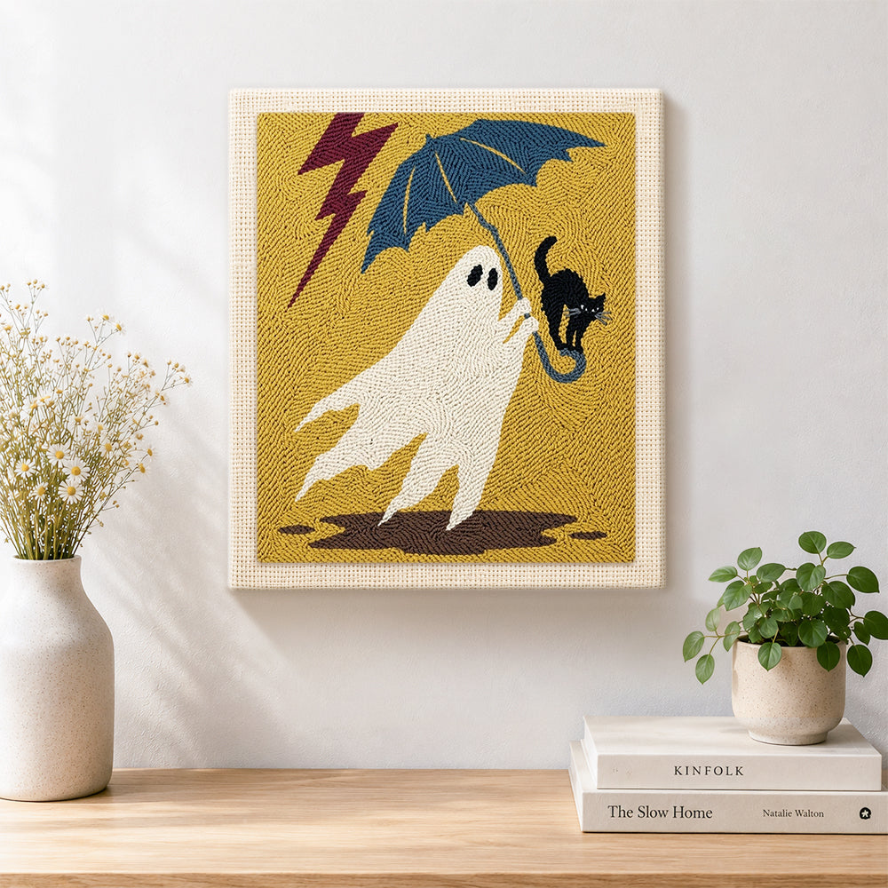 Finished stormy ghost with black cat artwork displayed on a wall