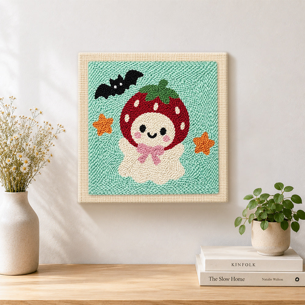 Finished strawberry ghost artwork displayed on a wall