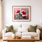 Finished striking red white hibiscus cross stitch artwork displayed as home decor