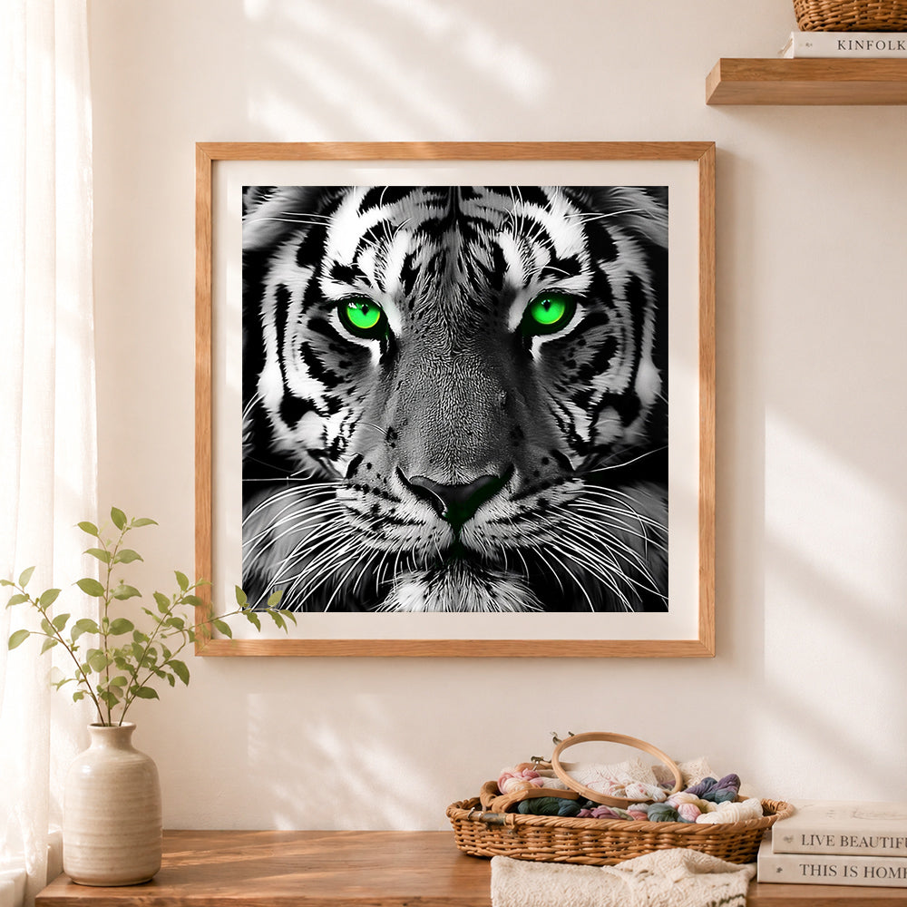Finished striking tiger with green eyes cross stitch artwork displayed as home decor