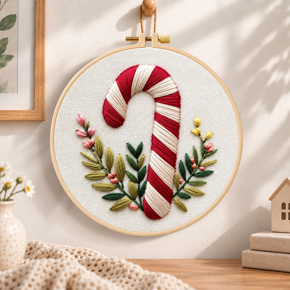 Striped candy cane embroidery hoop wall art displayed as warm and cozy handmade home decor