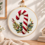 Striped candy cane embroidery hoop wall art displayed as warm and cozy handmade home decor