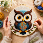 Creating the stylish blue and orange owl wool painting by hand with a felting needle