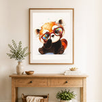 Finished stylish red panda cross stitch artwork displayed as home decor