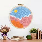 Finished sun over colorful clouds artwork displayed on a wall
