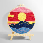 Sun over mountains with pink and red sky punch needle kit for beginners
