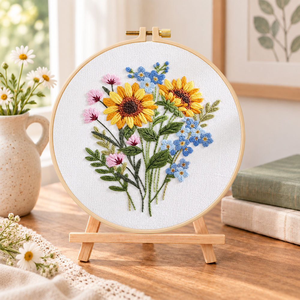 Sunflower bouquet embroidery kit finished hoop displayed on a wooden stand as cozy tabletop decor