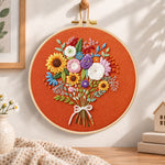 Sunflower bouquet on rust embroidery hoop wall art displayed as warm and cozy handmade home decor