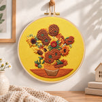 Sunflowers on golden background embroidery hoop wall art displayed as warm and cozy handmade home decor