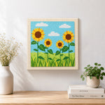 Finished sunflowers under the sky artwork displayed on a wall